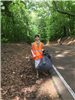Dalton Shaver helping Marvin and Sharon Johnson clean up DeSoto Rd.